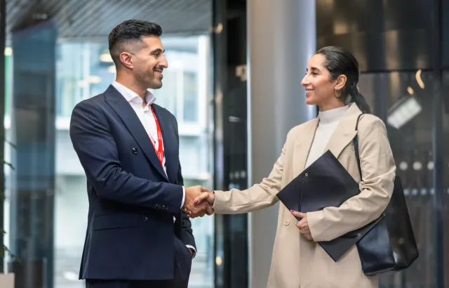 Friendly Circle K employee shaking hands with a customer