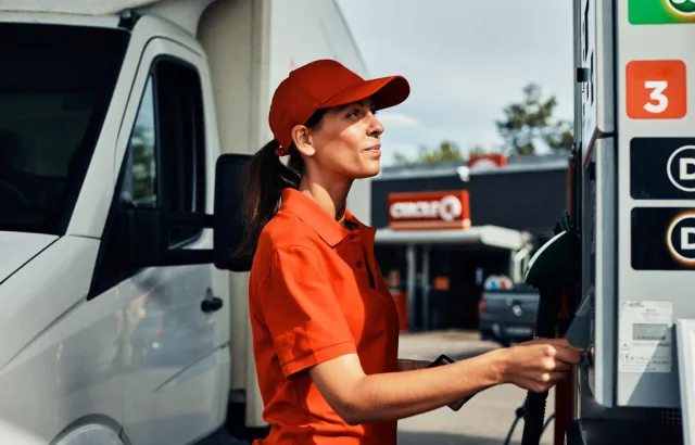 Woman preparing to fuel her vehicle at a Circle K station